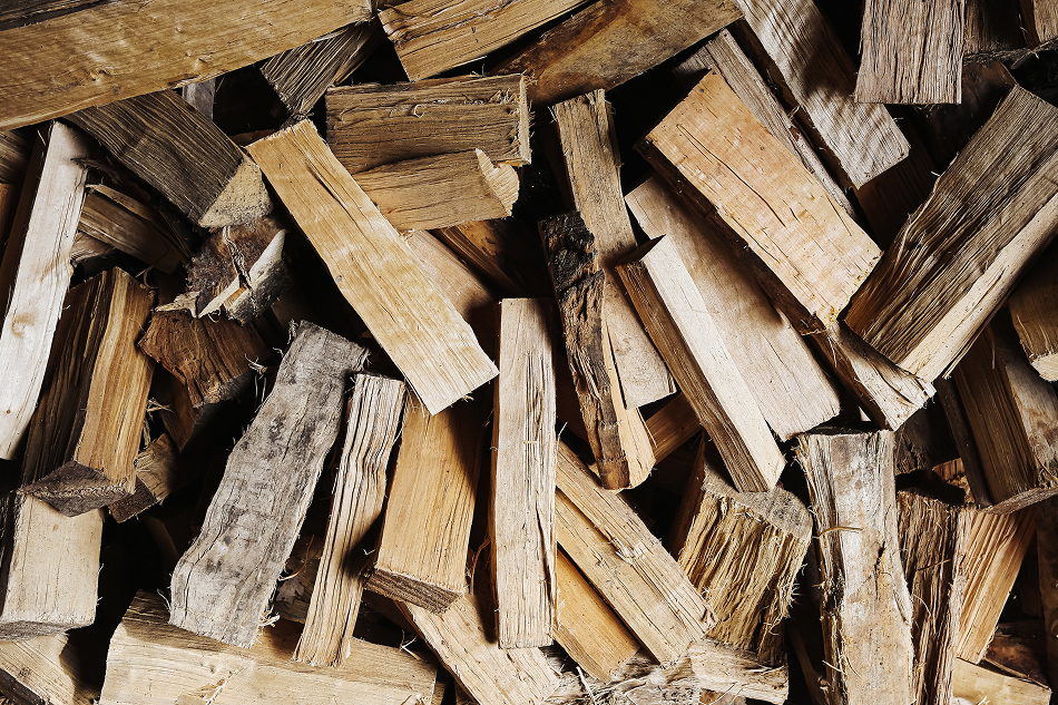 Seasoned cut and split hardwood firewood piled up for residential delivery